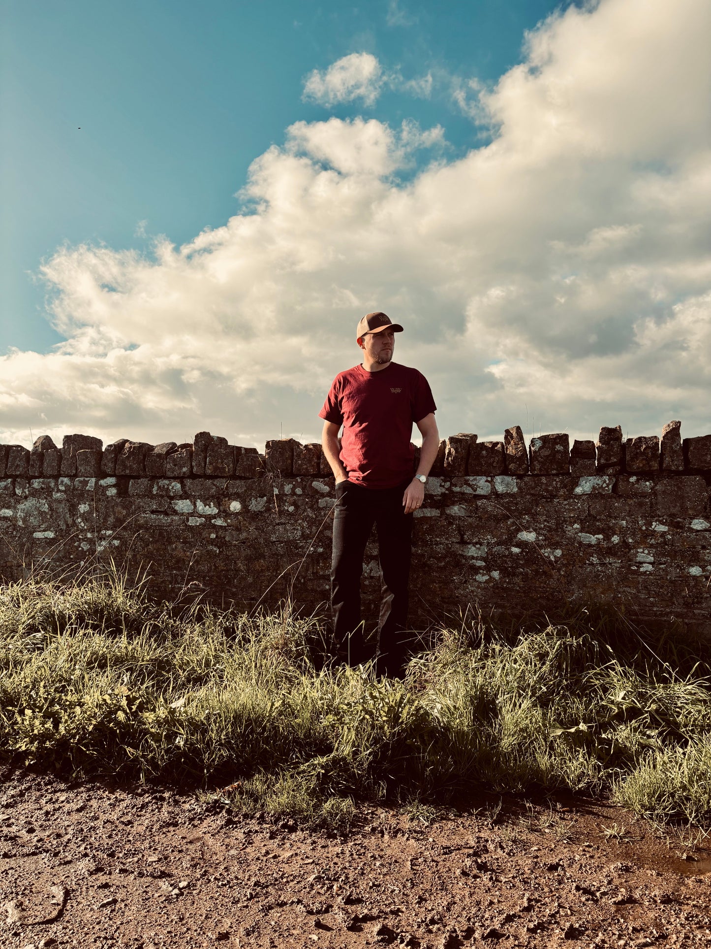 Discover the WanderWest Rusted Ranch Tee in Burgundy, crafted with 100% cotton and embroidered logo. Perfect for casual country and streetwear layering, order now!