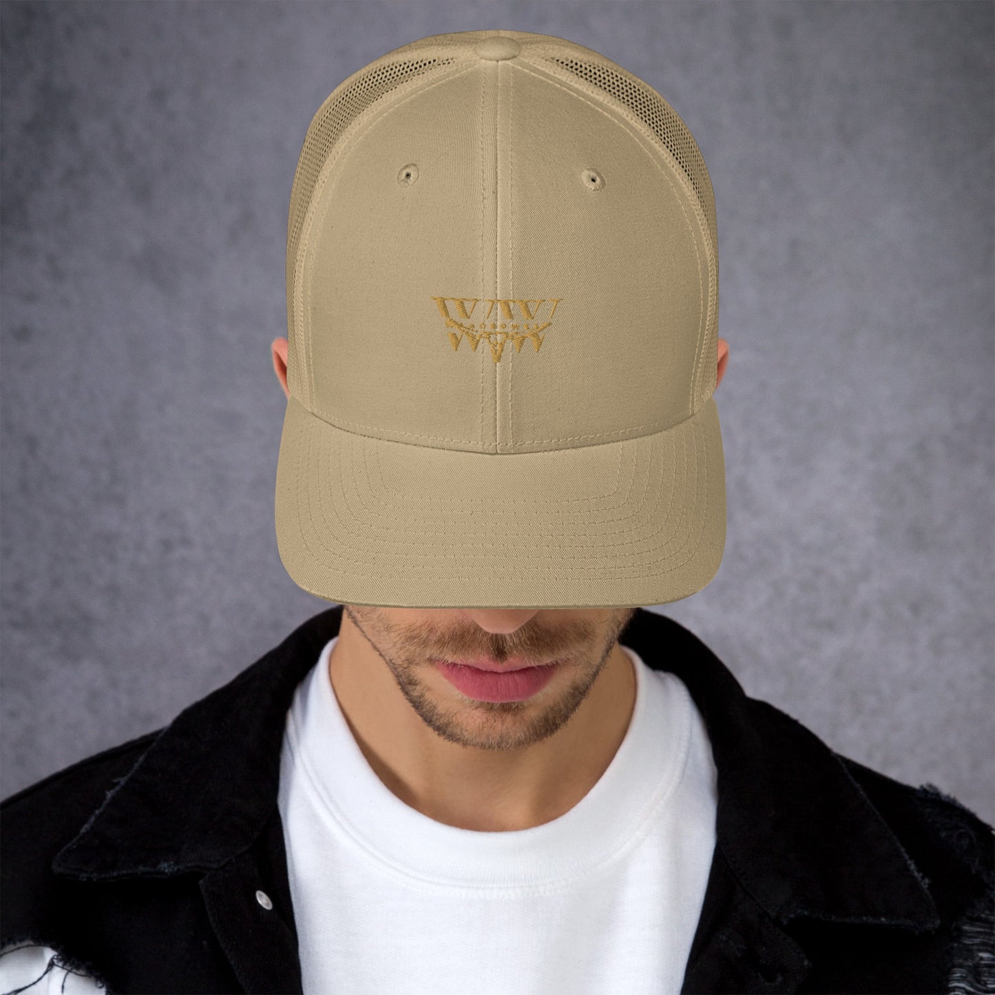 WanderWest Logo Trucker Cap, beige with mesh back and embroidery design.