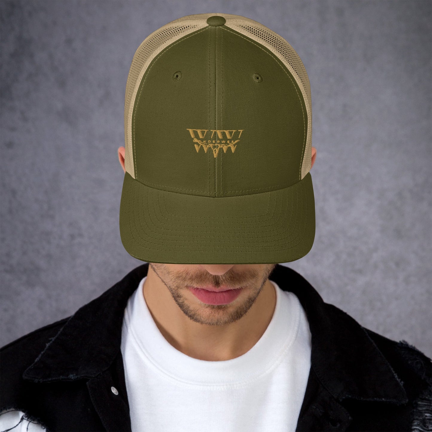 WanderWest Logo Trucker Cap with mesh back, mid-profile, structured design, and green embroidery.