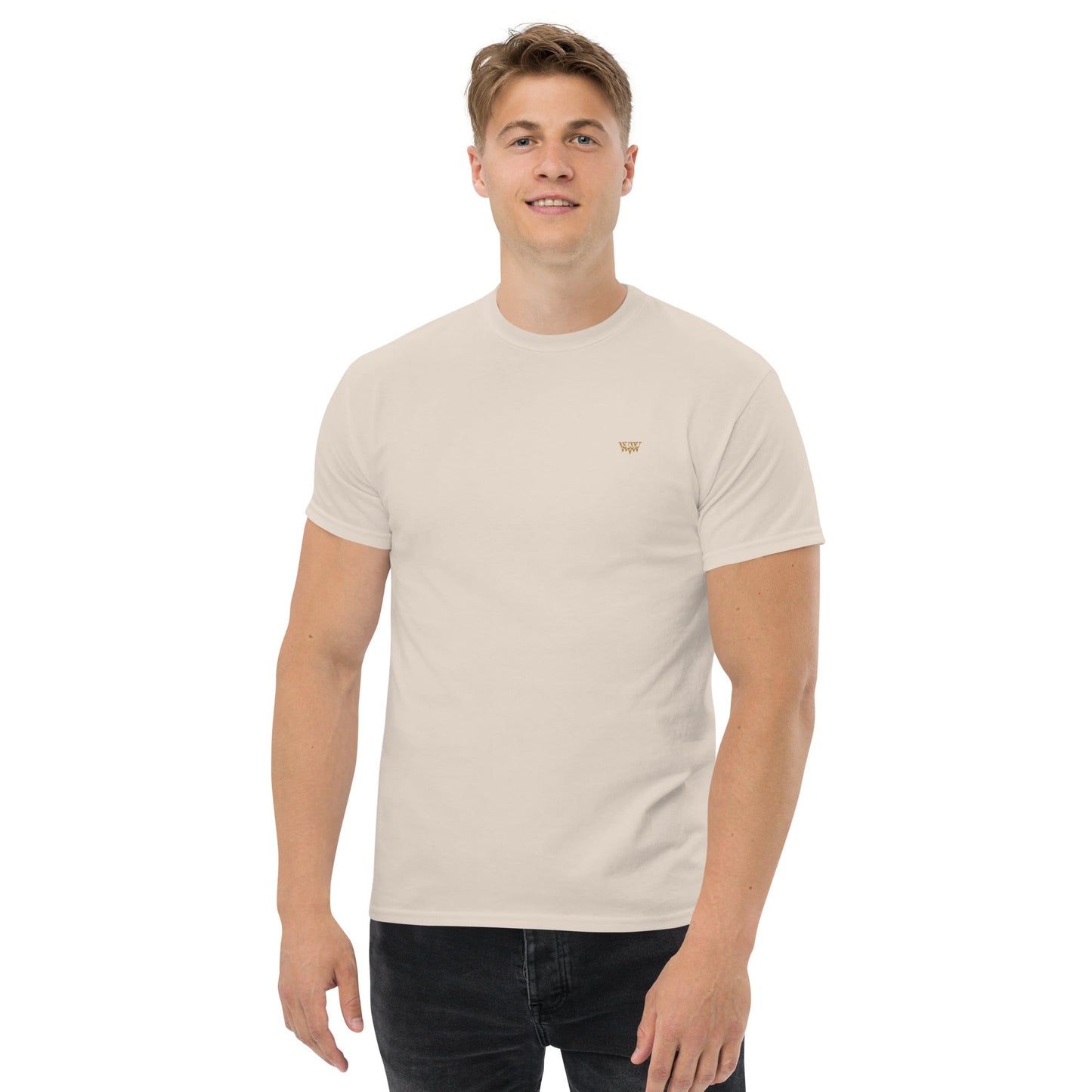 Man wearing off-white WanderWest logo embroidered unisex classic cotton tee with short sleeves and black pants
