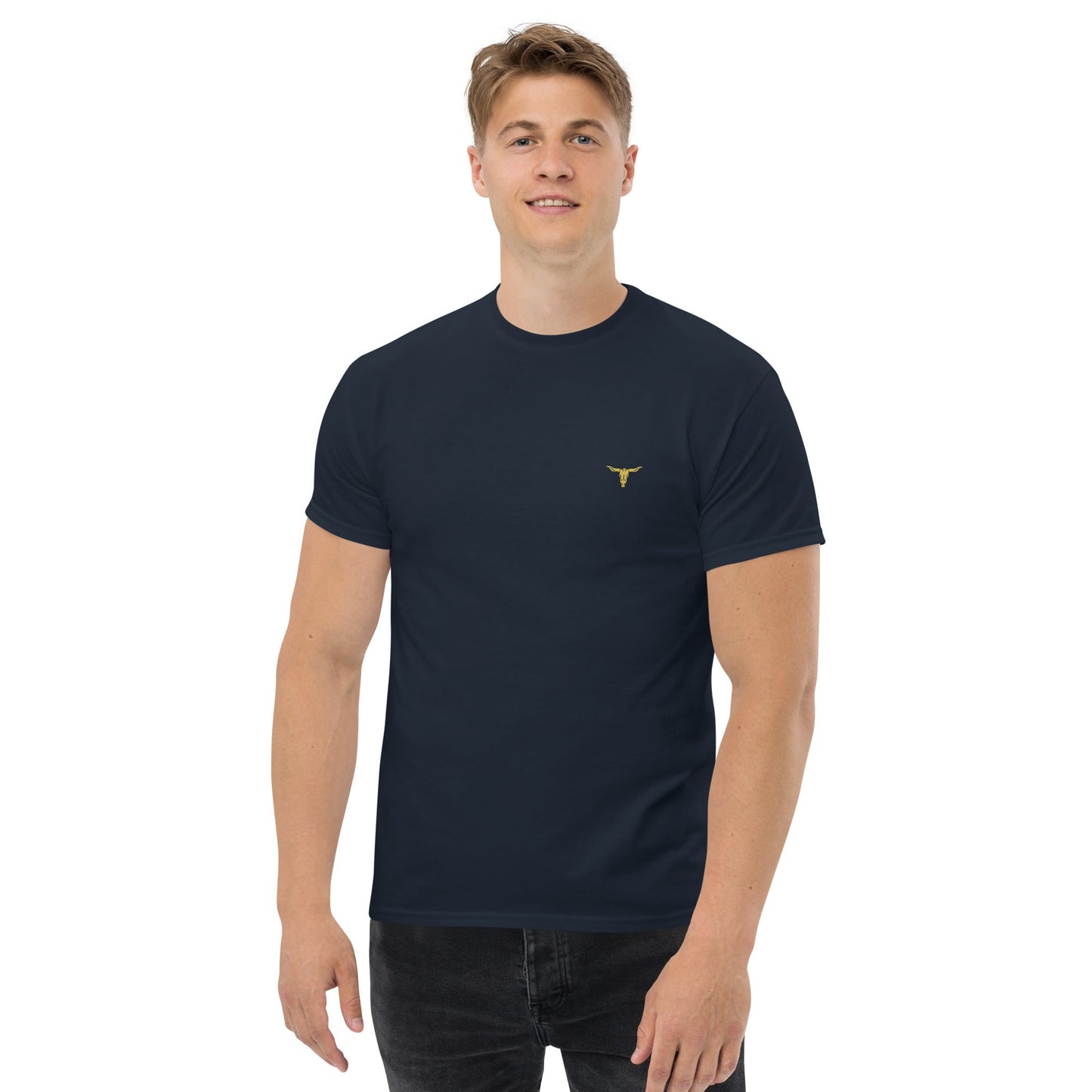 Man wearing a black Bull Horn Unisex classic tee with a small gold bull horn logo on the chest