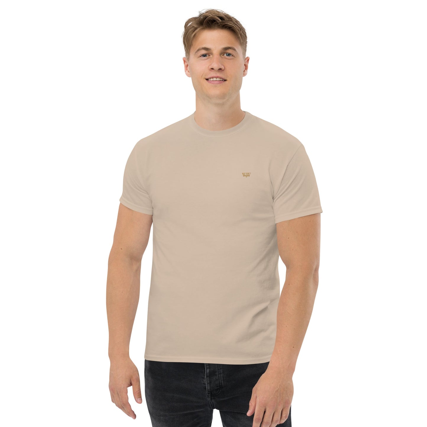 Man wearing a beige WanderWest logo embroidered unisex classic cotton tee shirt with short sleeves