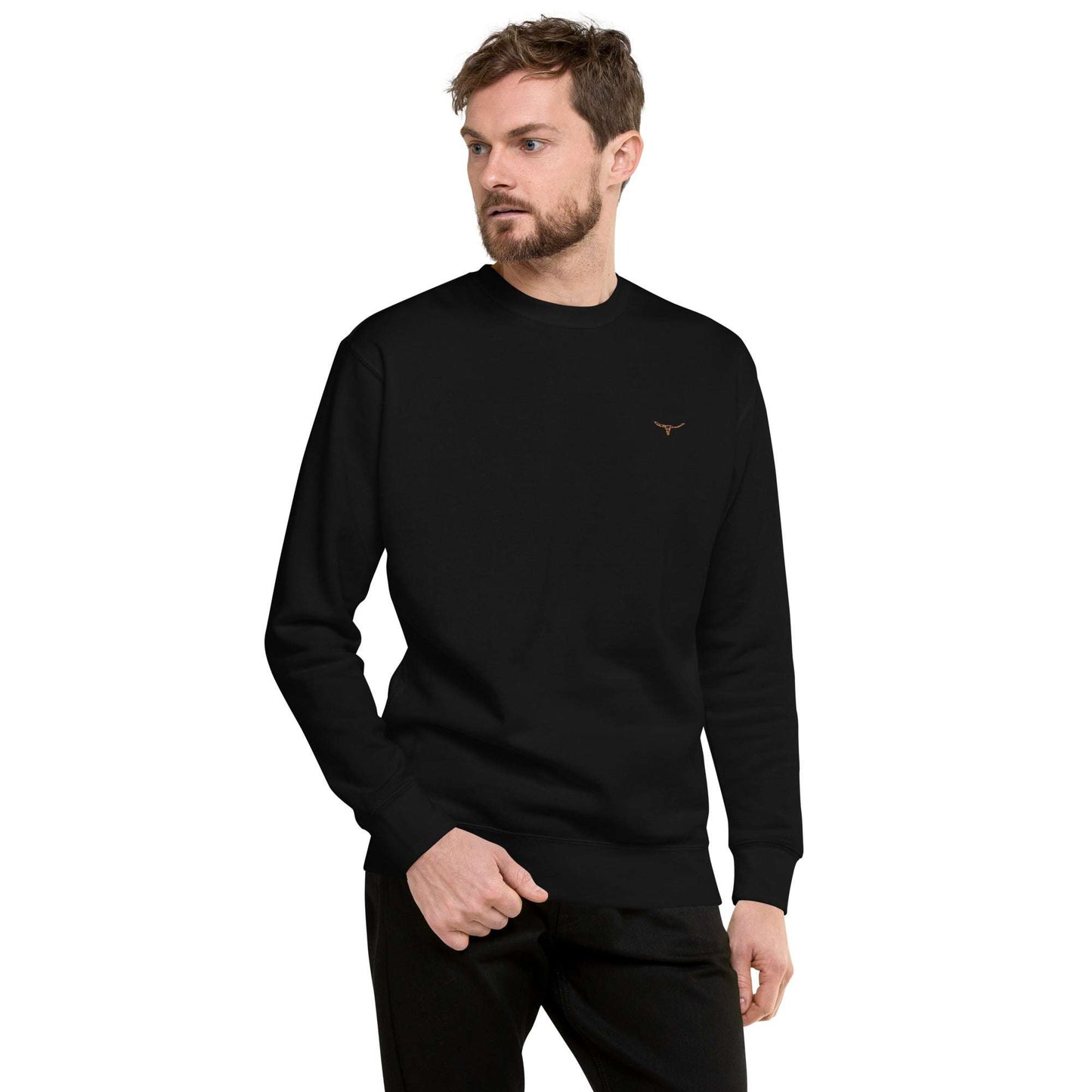 Man wearing black long horn skull embroidered crew neck sweatshirt