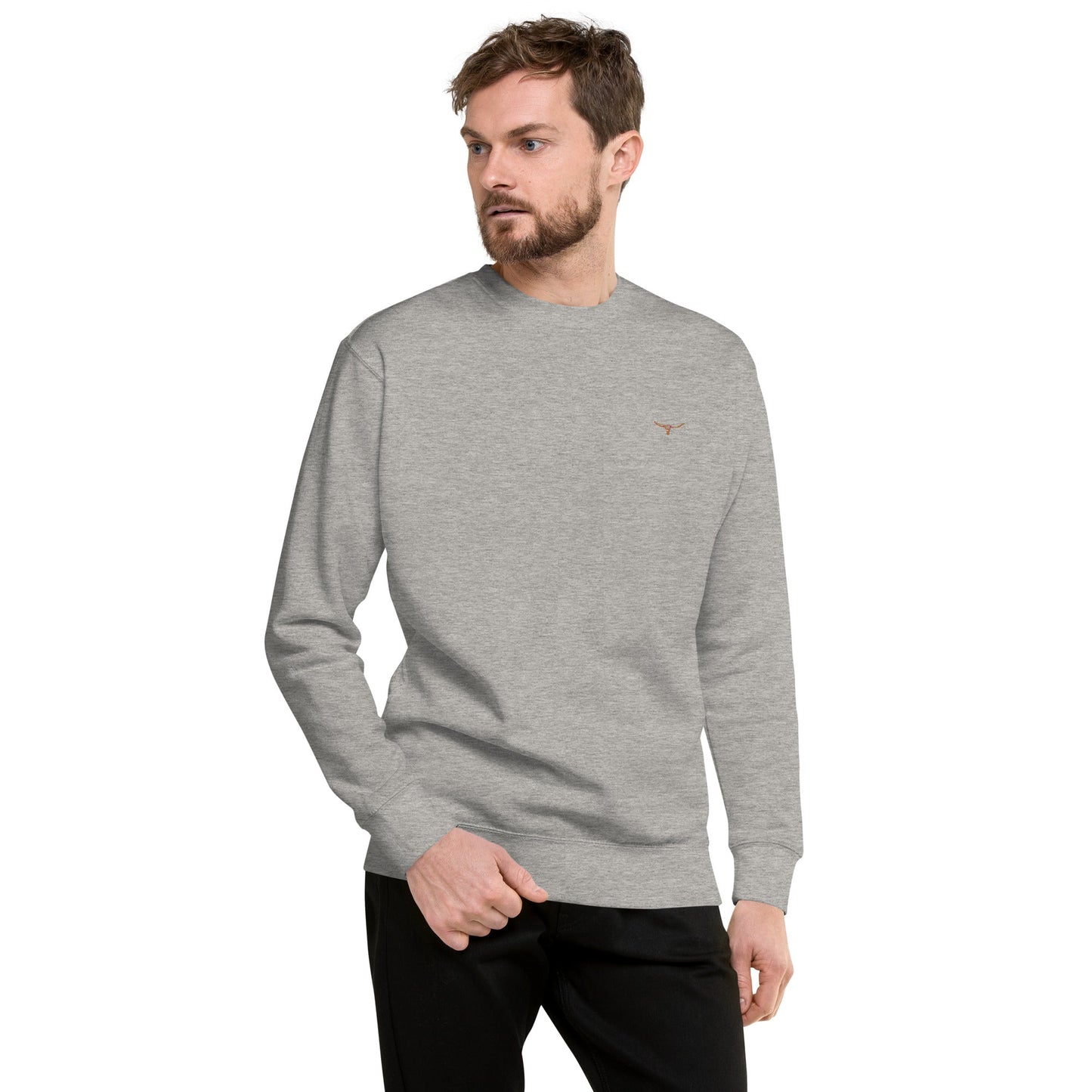 Unisex charcoal heather premium sweatshirt with small long horn skull embroidered on left chest, ribbed crew neck, cuffs, and hem, made from soft fleece fabric.