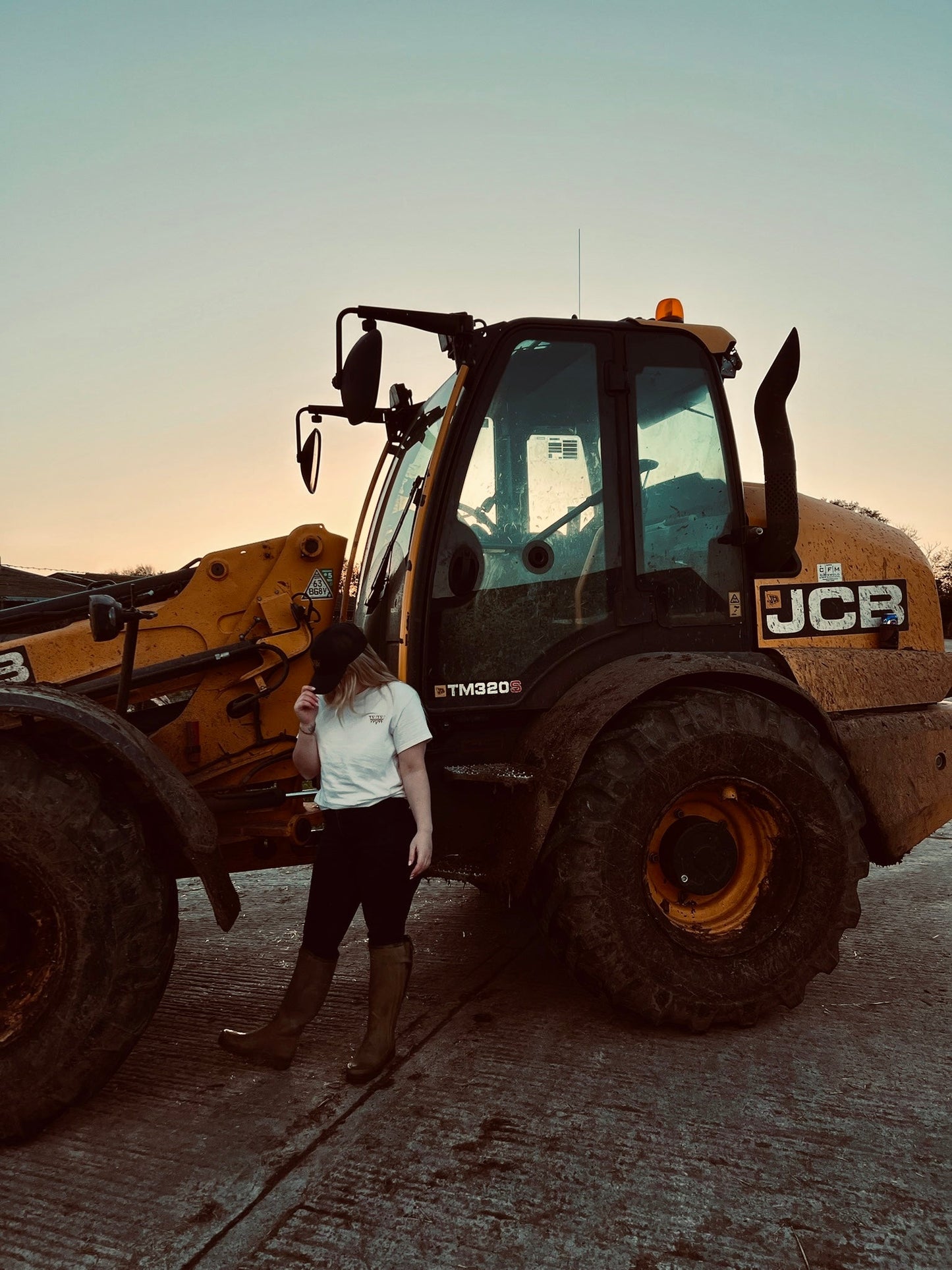 The WanderWest Homestead Tee – Natural, crafted from 100% cotton, perfect for relaxed country looks with embroidered logo. Conscious, stylish, and comfortable wear.