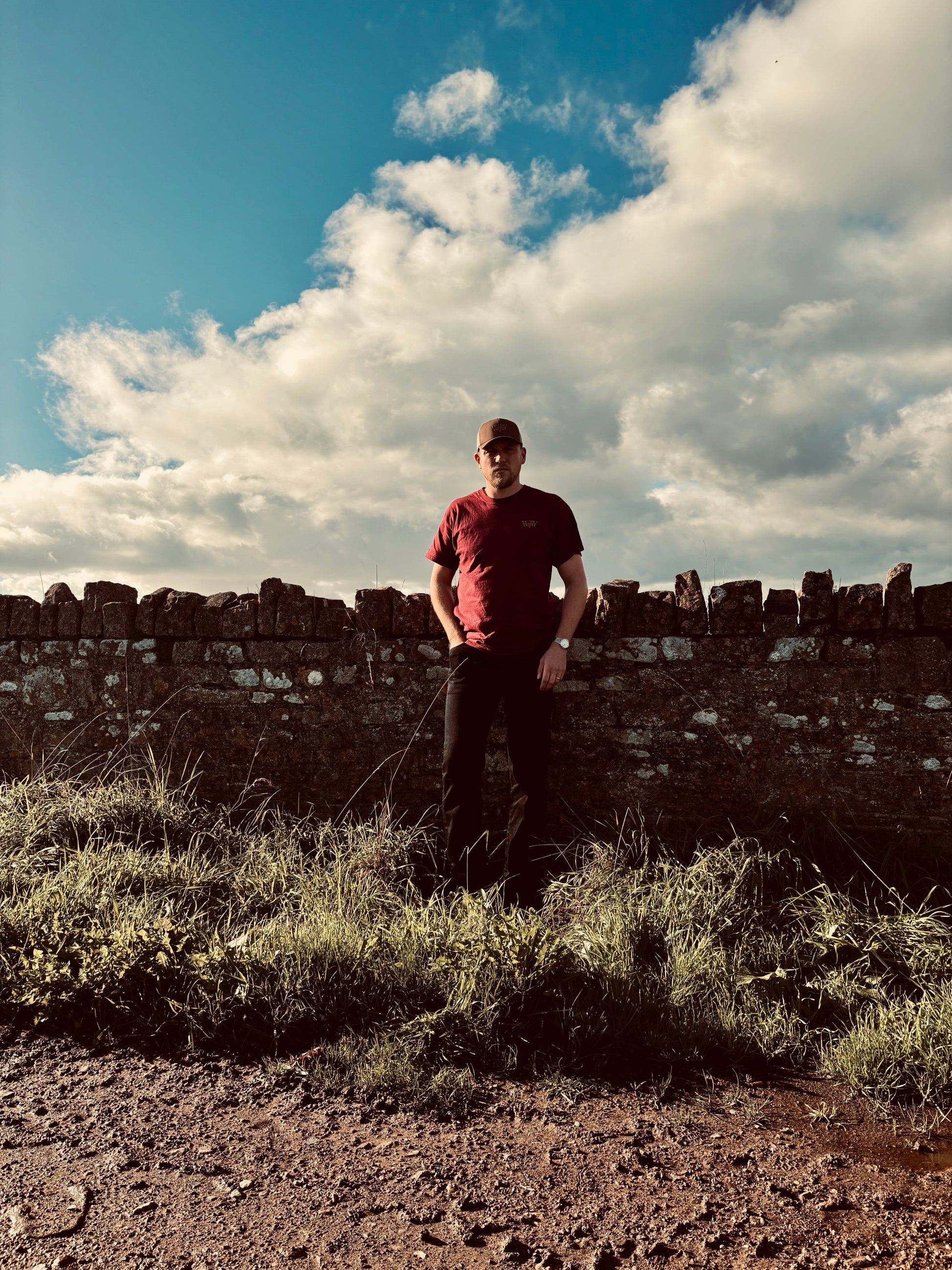 Discover the WanderWest Rusted Ranch Tee in Burgundy, crafted with 100% cotton and embroidered logo. Perfect for casual country and streetwear layering, order now!