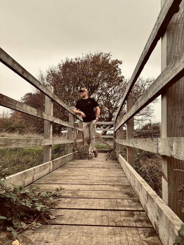 The WanderWest Midnight Rider Tee for a bold, versatile black shirt with embroidered logo, perfect for casual country or streetwear looks. Style and comfort.