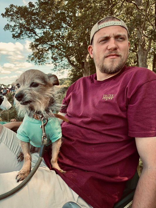 Discover the WanderWest Rusted Ranch Tee in Burgundy, crafted with 100% cotton and embroidered logo. Perfect for casual country and streetwear layering, order now!