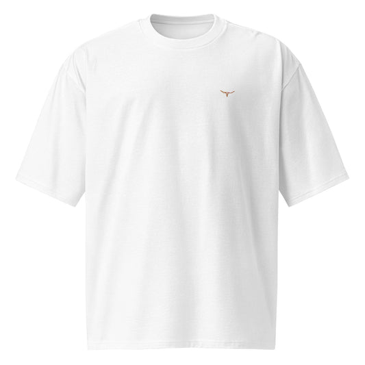 White oversized heavyweight t-shirt with small embroidered long horn skull on chest, breathable cotton fabric, unisex streetwear style.