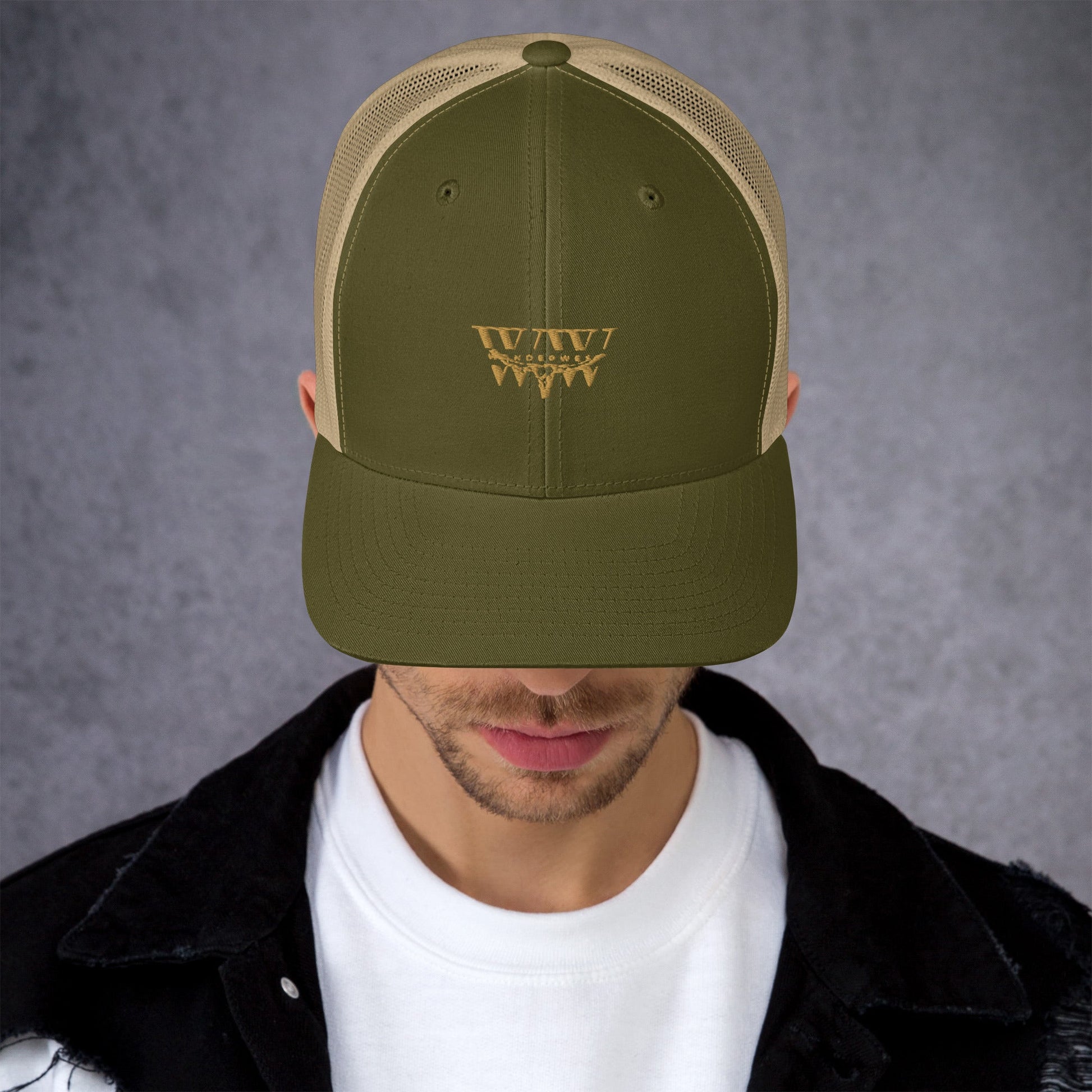 WanderWest Logo Trucker Cap with mesh back, mid-profile, structured design, and green embroidery.