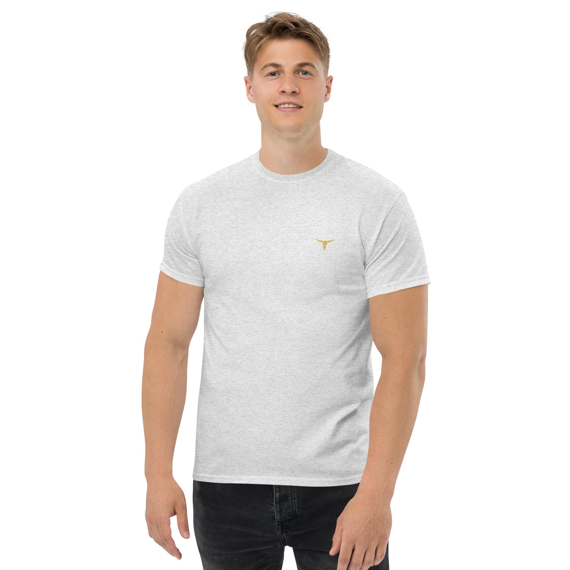 Bull skull unisex classic tee in light grey worn by a male model, featuring a small yellow bull skull graphic on the chest.