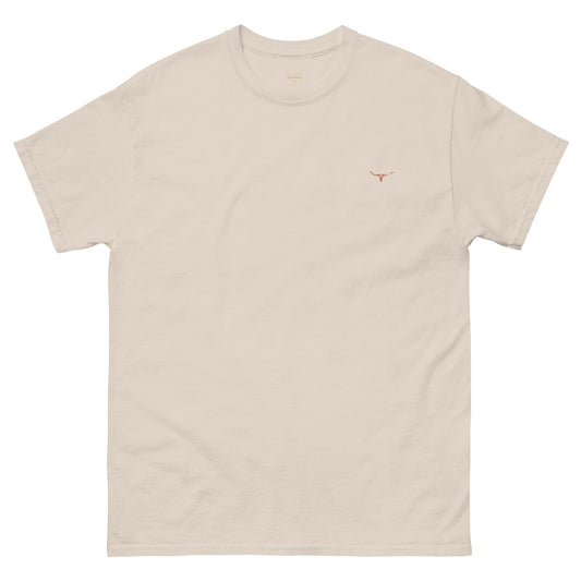Front view of the WanderWest Longhorn Bull Skull Homestead T-shirt in Natural — country-style tee featuring an embroidered bull skull design and branded logo, displayed on a plain background.