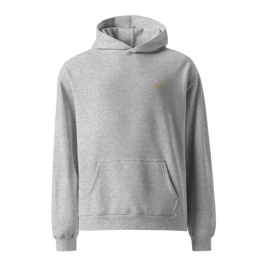 Gray oversized unisex hoodie with WanderWest logo embroidery, kangaroo pocket, and ribbed cuffs made of soft cotton and